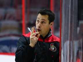 Senators head coach Guy Boucher instructs his players during team practice at the Canadian Tire Centre in Ottawa on Oct. 21, 2016. (Errol McGihon/Postmedia)