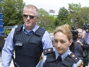 File photo - OSPCA officers walk towards the Toronto Humane Society building back in 2009 (Postmedia Network files)