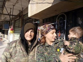 Drayton Valley’s Shaelynn Jabs (left) is in Syria for the second time fighting against the Islamic State. The 20-year-old is also focused on women’s rights and rebuilding in Syria, according to her mother Brenda Jabs. Pictured here is Jabs during her first visit.