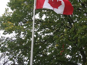 One flag in front of Clinton’s library waving. (Justine Alkema/Clinton News Record)