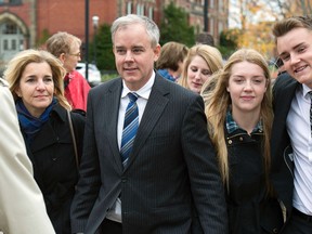 Dennis Oland and his wife Lisa, along with family members and friends, head from a bail hearing after he was released from custody in Fredericton on Tuesday, Oct. 25, 2016. (THE CANADIAN PRESS/Andrew Vaughan