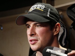 Pittsburgh Penguins' Sidney Crosby talks with reporters at his locker after skating at the Penguins' practice facility in Cranberry Township, Pa., Tuesday, Oct. 11, 2016. (THE CANADIAN PRESS/AP/Gene J. Puskar)