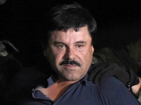 This file photo taken on January 08, 2016 shows drug kingpin Joaquin "El Chapo" Guzman escorted into a helicopter at Mexico City's airport following his recapture during an intense military operation in Los Mochis, in Sinaloa State. (ALFREDO ESTRELLA/AFP/Getty Images)