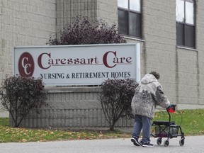 A woman walks into the Caressant Care facility in Woodstock, Ont. on Tuesday, Oct. 25, 2016. (THE CANADIAN PRESS/Dave Chidley)