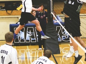 Hawk Ayden Grant smashes the ball during the game Oct. 17 against the Holy Trinity Academy from Okotoks at the Cultural-Recreational Centre. Jasmine O’Halloran-Han Vulcan Advocate