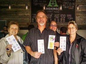 Craft beer explorers Marie Hood, left, Mike Boniface, Natalie Gentle and Cynthia Gentle were the first with fully stamped HOP ME passports after visiting 10 London-area breweries. (Contributed)