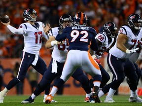 Houston Texans QB Brock Osweiler (left) took a drubbing in Denver, going 22-for-41 for 131 yards without a touchdown.