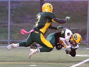 Lockerby Vikings David Pushman gets taken down by Curtis Theobald of the Confederation Chargers during senior boys high school football action in Sudbury, Ont. on Tuesday October 25, 2016. Gino Donato/Sudbury Star/Postmedia Network