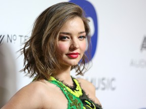 FILE - In this Feb. 15, 2016 file photo, Miranda Kerr arrives at the Warner Music Group Grammy Awards After Party at Milk Studios in Los Angeles. Los Angeles prosecutors on Tuesday, Oct. 25, charged Shaun Anthony Haywood, a 29-year-old native of Brisbane, Australia, with three felony charges including attempted murder after he was shot and arrested outside Kerr’s Malibu home on Oct. 14, after he slashed a security guard with a knife. (Photo by Rich Fury/Invision/AP, File)