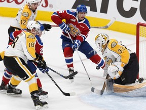 Davis Koch is stopped by Wheat Kings goalie Jordan Papirny during Tuesday's game at Rogers Place. (Ian Kucerak)