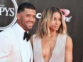 In this July 13, 2016, file photo, NFL football player Russell Wilson, of the Seattle Seahawks, left, and Ciara arrive at the ESPY Awards at the Microsoft Theater in Los Angeles. Both stars announced that Ciara is expecting the couple's first child in dual Instagram posts on Oct. 25, 2016. (Photo by Jordan Strauss/Invision/AP, File)