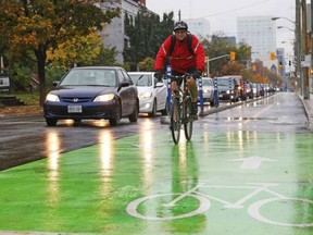 The bikeway on O'Connor Street officially opened Tuesday, hours before a cyclist was struck by a vehicle on the lane. JEAN LEVAC / POSTMEDIA NEWS