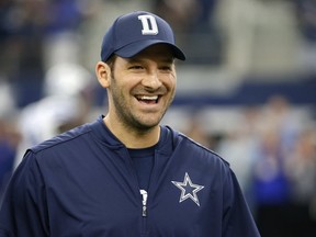 Dallas Cowboys quarterback Tony Romo smiles as he talks with teammates on the field during warm ups before an NFL football game against the Cincinnati Bengals on Sunday, Oct. 9, 2016, in Arlington, Texas. (AP Photo/Ron Jenkins)