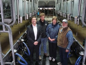 Agriculture and Forestry Minister Oneil Carlier announced today, Oct 24 a $10-million farm efficiency grant program that will benefit operations such as the Schuurman Dairy Farm in Millet. Jordan Schuurman and his parents Susan and Evan Schuurman own and operate this dairy farm.| Contributed photo/Government of Alberta