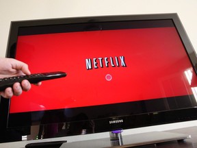 A person uses Netflix in Palo Alto, Calif in this July 20, 2010 file photo. (THE CANADIAN PRESS/AP/Paul Sakuma)