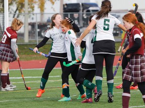 Holy Cross Crusaders players celebrate Anna Rhines’ goal during the first half of the Kingston Area Secondary Schools Athletic Association girls field hockey championship game at CaraCo Field on Wednesday.
(Julia McKay/The Whig-Standard)