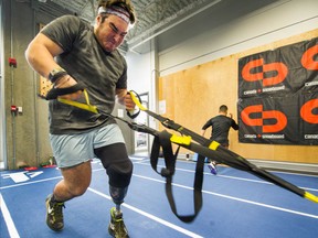 Canadian para-snowboarding team member Ali Massie works out in Vancouver on Oct. 25, 2016. (Arlen Redekop/Postmedia Network)