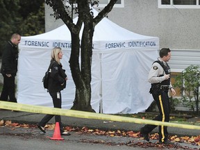 The scene of a crash in Burnaby, B.C., after a man was shot and crashed his car into a house.  (NICK PROCAYLO/PostMedia)