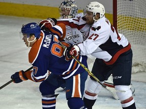 Capitals defenceman Karl Alzner, shown here pushing Connor McDavid in front of the Washington net during a game last season, planned to ask the Oilers captain for his stick after Wednesday's game. (Ed Kaiser)