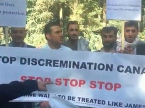 Afghan interpreters protest outside the Canadian Embassy in Kabul on Wednesday, Oct. 26, 2016. (Screengrab)
