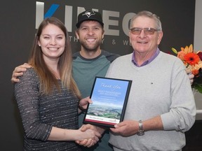 Vermilion Mayor Bruce MacDuff presents Kaylyn Gordon and Cale Staden with a business plaque at the grand opening of their business Kinect Physiotherapy and Wellness, on Saturday, Oct. 22 in the Lakeland Mall.