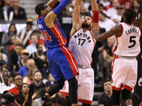 Toronto Raptors centre Jonas Valanciunas blocks a shot from the Detroit Pistons in their regular season debut at the ACC last night. Valanciunas had a career-best 32-point night. (Stan Behal/Toronto Sun)