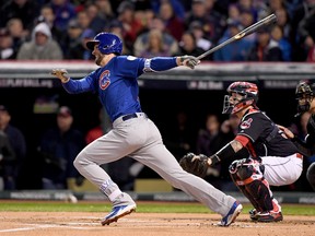 Cubs’ Kris Bryant hits a single during Game 2 last night against the Cleveland Indians on Wednesday night. (GETTY IMAGES)