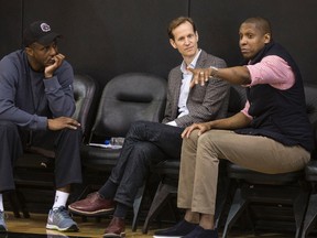 New Raptors general manager Jeff Weltman (centre), seen here with head coach Dwane Casey (left) and team president Masai Ujiri last year, is embracing his new role with the team. (Craig Robertson/Toronto Sun/Files)
