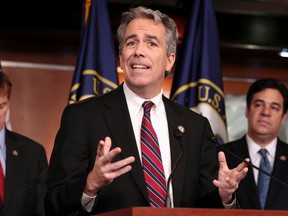 In this Nov. 15, 2011, file photo former U.S. Rep. Joe Walsh, R-Ill., gestures during a news conference on Capitol Hill in Washington. Walsh tweeted on Oct. 26, 2016, that he plans plans to grab his musket if GOP nominee Donald Trump loses the presidential election. Walsh later said on Twitter that he was referring to “acts of civil disobedience.” (AP Photo/Carolyn Kaster, File)