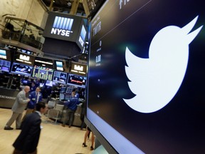 In this July 27, 2016, file photo, the Twitter symbol appears above a trading post on the floor of the New York Stock Exchange. Twitter, seemingly unable to find a buyer and losing money, is cutting about 9 percent of its employees worldwide. The company also announced third-quarter results Thursday, Oct. 27. (AP Photo/Richard Drew, File)