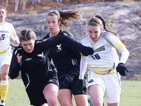 Laurentian Voyageurs Sarah Sanford battles for the ball during OUA playoff action against the Carleton Ravens at the Laurentian University Soccer Fieldin Sudbury, Ont. on Wednesday October 26, 2016. Gino Donato/Sudbury Star/Postmedia Network