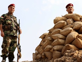Iraqi Kurdish peshmerga fighters hold a position on October 27, 2016 on the top of Mount Zardak, about 25 kilometres east of Mosul, as they take part in an operation against Islamic State (IS) group jihadists. Iraqi security forces and Kurdish peshmerga fighters are pushing toward Mosul along several axes and have made relatively quick progress as they approach Mosul, Iraq's second city. (SAFIN HAMED/AFP/Getty Images)