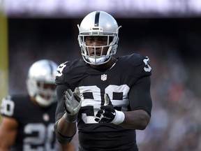Outside linebacker Aldon Smith of the Oakland Raiders celebrates in the third quarter against the Minnesota Vikings at O.co Coliseum on November 15, 2015 in Oakland, California. (Thearon W. Henderson/Getty Images)