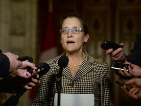 International Trade Minister Chrystia Freeland talks to reporters in the foyer outside the House of Commons on Parliament Hill in Ottawa on Thursday, October 27, 2016. THE CANADIAN PRESS/Adrian Wyld