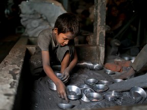 A.M. Ahad/The Associated Press
In this June 12 photo, Ridoy, 7, works at a factory that makes metal utensils in Dhaka, Bangladesh, earning less than $5 per week.