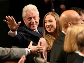 This file photo taken on October 19, 2016 shows former US President Bill Clinton and his daughter Chelsea Clinton attending the final presidential debate at the Thomas & Mack Center on the campus of the University of Las Vegas in Las Vegas, Nevada. (SAUL LOEB/AFP/Getty Images)