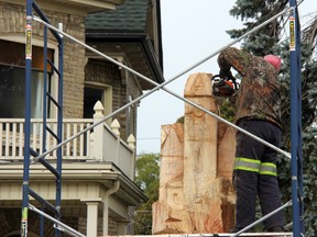 Carving artist Kane Sibley of Mount Brydges working on his third tree sculpture in the municipality on Wednesday, Oct. 26. JONATHAN JUHA/ STRATHROY AGE DISPATCH/ POSTMEDIA NETWORK
