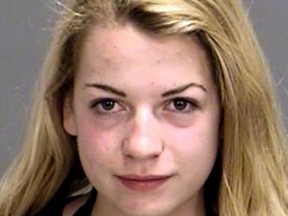 This undated photo provided by the Bryan (Texas) Police Department shows a booking photo of Miranda Kay Rader. The Texas A&M University student is free on bond after the vehicle she was driving rear-ended a Bryan police car - allegedly while she was photographing herself topless. (Bryan Police Department via AP)