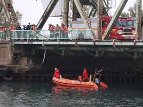 Toronto Police and Toronto Fire at the scene on Cherry St. after a car went into the water on Thursday, Oct. 27, 2016. (Stan Behal/Toronto Sun)