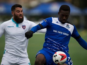 Tomi Ameobi battles a member of Miami FC for the ball during a game in Edmonton in September. The Eddies finish off the season in Miami on Friday. (Greg Southam)