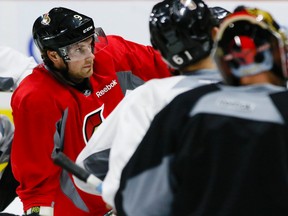 The Senators had a scary moment when winger Bobby Ryan (left) took a puck off the ankle in practice.