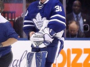 Maple Leafs goalie Frederik Andersen gets cut by the stick of Panthers' Colton Sceviour in the third period as the Leafs went on to beat the Panthers 3-2 in Toronto on Thursday, Oct. 27, 2016. (Stan Behal/Toronto Sun)