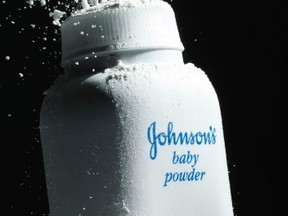 In this April 19, 2010, file photo, Johnson's baby powder is squeezed from its container, in Philadelphia. A St. Louis jury has ordered Johnson & Johnson to pay a second huge award over claims that its talcum powder causes cancer. The company was ordered Monday, May 2, 2016, to pay a multi- million dollar settlement to a South Dakota woman who blamed her ovarian cancer on years of baby powder use. (AP Photo/Matt Rourke, File)