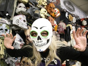 Gino Donato/Sudbury Star
Julie Jacques, a sales associate at Spirit Halloween on Notre Dame Avenue, dons a mask on Thursday. The forecast for Halloween Monday calls for a high of 7 degrees C with a chance of showers.