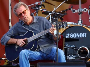 In this April 27, 2014 file photo, Eric Clapton performs at the 2014 New Orleans Jazz & Heritage Festival at Fair Grounds Race Course in New Orleans. (John Davisson/Invision/AP)
