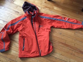 The orange jacket offered to injurd cyclist by a stranger.