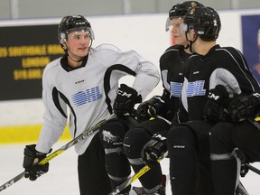 London Knights forward Cole Tymkin, left, during a break in practice at the Western Fair on Thursday October 27, 2016. (MORRIS LAMONT, The London Free Press)