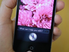 In this photo taken Monday Oct. 10, 2011, Siri, Apple's virtual assistant, is displayed on the Apple iPhone 4S in San Francisco.  (AP File Photo/Eric Risberg, File)