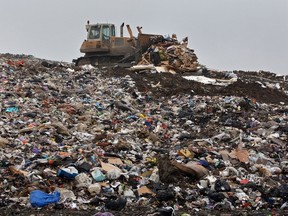 A bull dozer moves rubbish at the Shelford Landfill, Recycling & Composting Centre on August 23, 2007 near Canterbury, England. (Photo by Peter Macdiarmid/Getty Images)