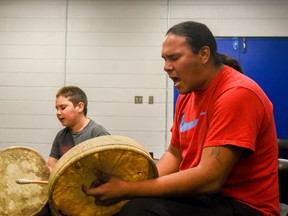 Moise Dreaver leads the drum and sing circle at the Enoch Youth Centre on Oct. 20, 2016. The circle is open for kids wishing to learn how to drum and sing - Photo by Yasmin Mayne.